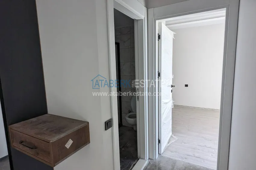 Purchase  One bedroom apartment with separate kitchen and side sea view in Mersin, Tomyuk district 3 