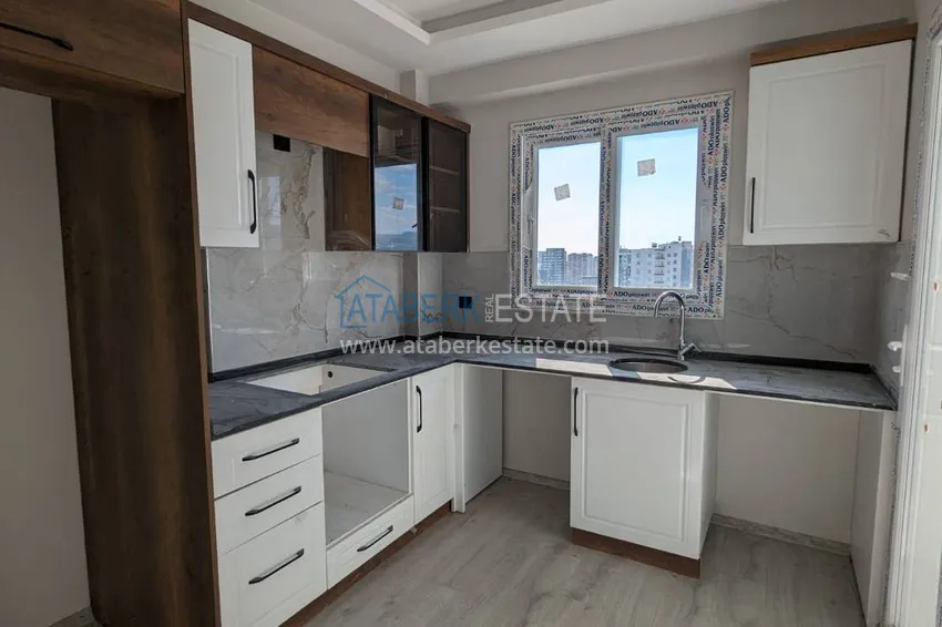 Purchase  One bedroom apartment with separate kitchen and side sea view in Mersin, Tomyuk district 5 