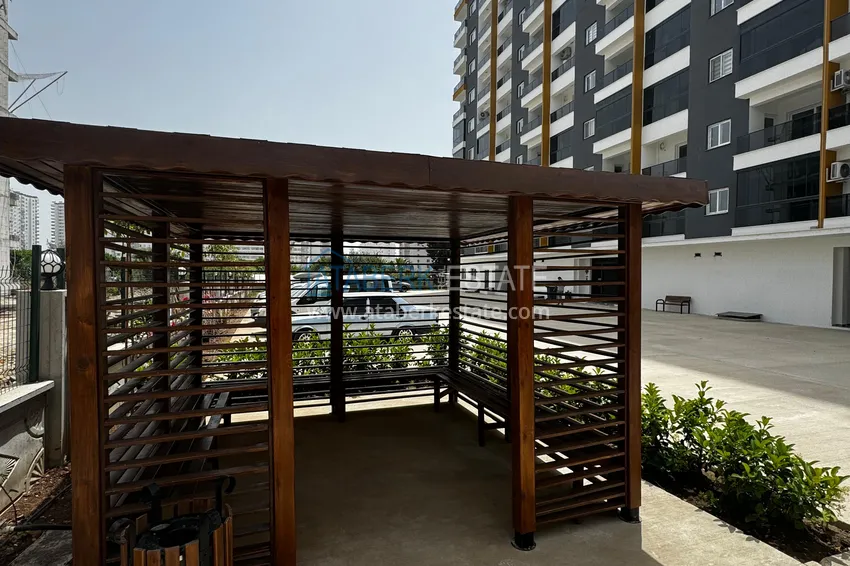 One bedroom apartment with separate kitchen and side sea view in Mersin, Tomyuk district 12 