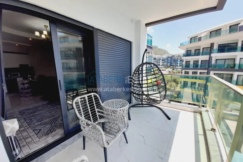 Purchase  1+1 apartment with furniture and sea views in a complex on the beachfront — Alanya, Kargicak district 17 
