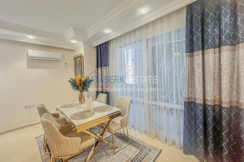 Purchase Two-bedroom apartment with new furniture and a glazed balcony in Mahmutlar 10 