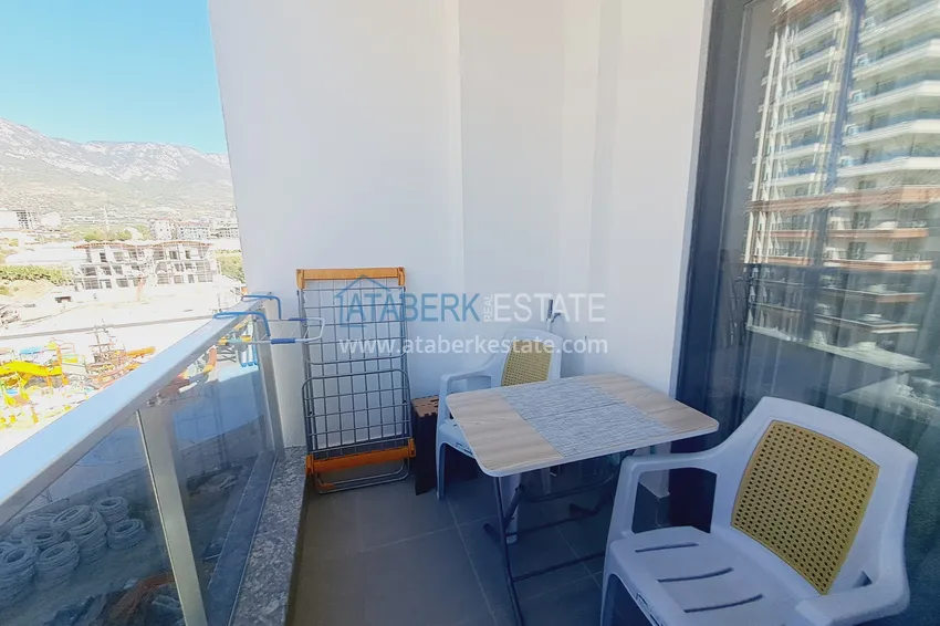 Purchase  Apartment 1+1 with furniture and mountain views in a complex with hotel infrastructure, Mahmutlar district — Alanya  11 