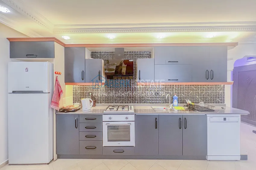 Purchase Two-bedroom apartment with new furniture and a glazed balcony in Mahmutlar 12 