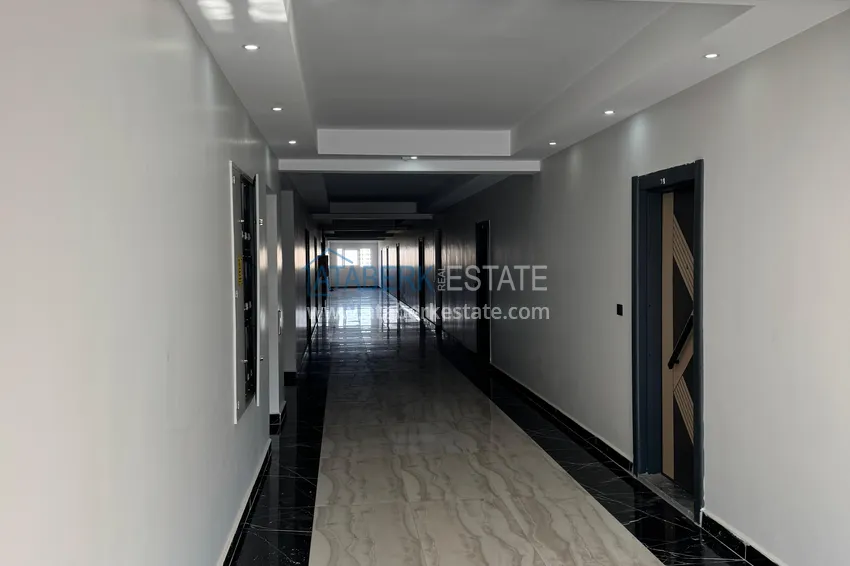 Two-bedroom apartment with furniture and a glazed balcony in Mersin - Tomyuk 13