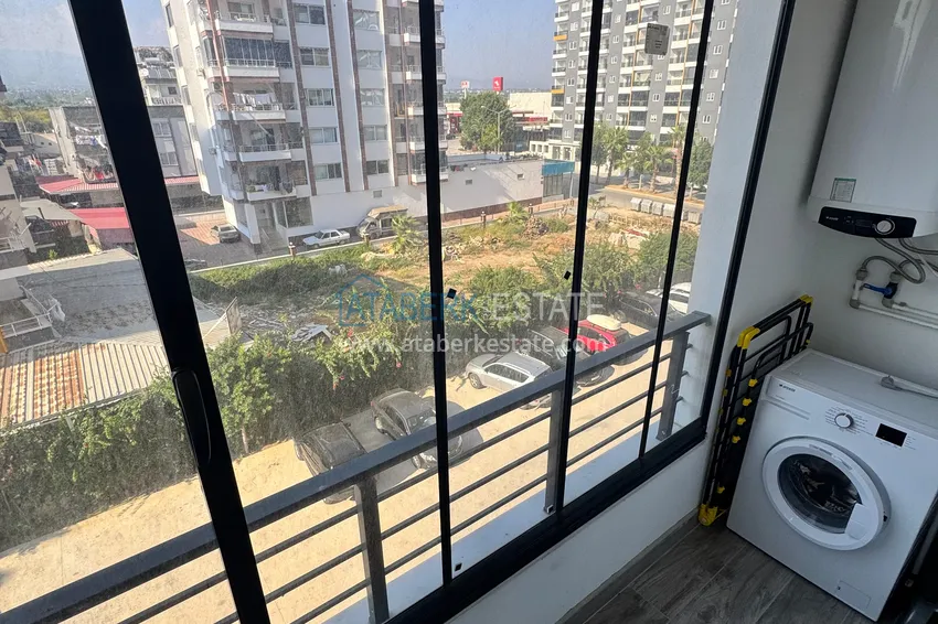 Purchase Two-bedroom apartment with furniture and a glazed balcony in Mersin - Tomyuk 19