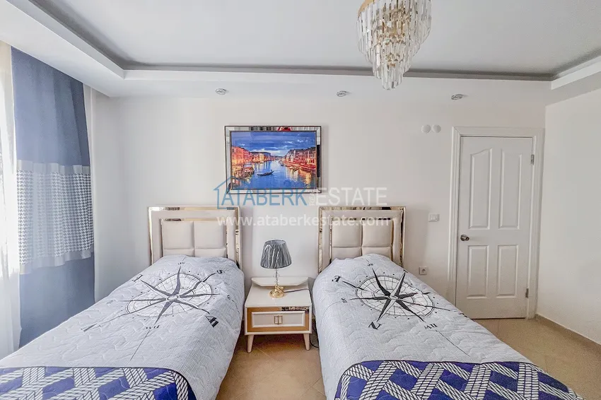 Purchase Two-bedroom apartment with new furniture and a glazed balcony in Mahmutlar 20 