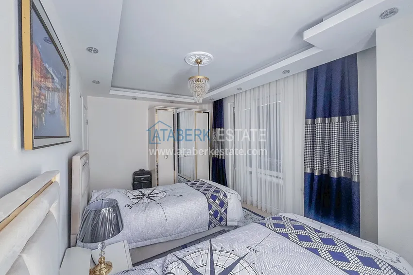 Purchase Two-bedroom apartment with new furniture and a glazed balcony in Mahmutlar 21 
