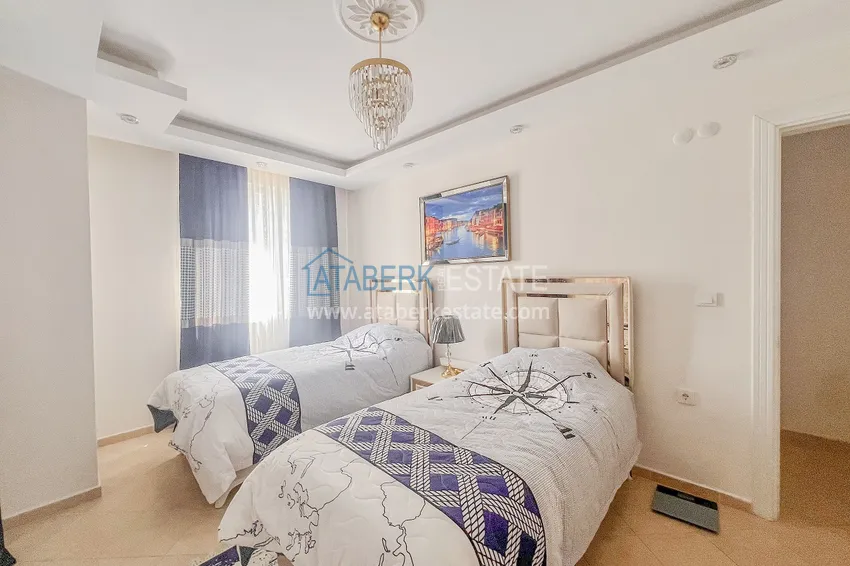 Purchase Two-bedroom apartment with new furniture and a glazed balcony in Mahmutlar 22 