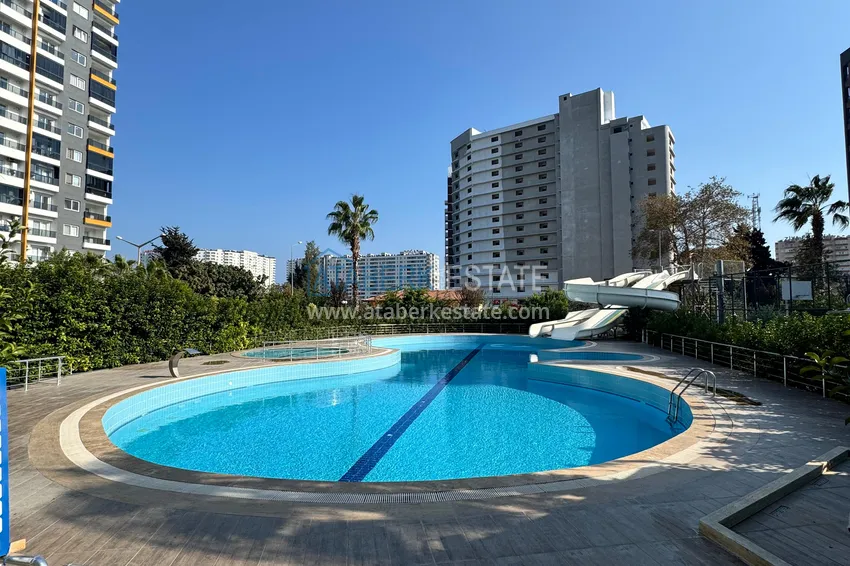 Two-bedroom apartment with furniture and a glazed balcony in Mersin - Tomyuk 3