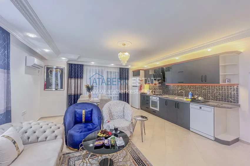 Purchase Two-bedroom apartment with new furniture and a glazed balcony in Mahmutlar 8 