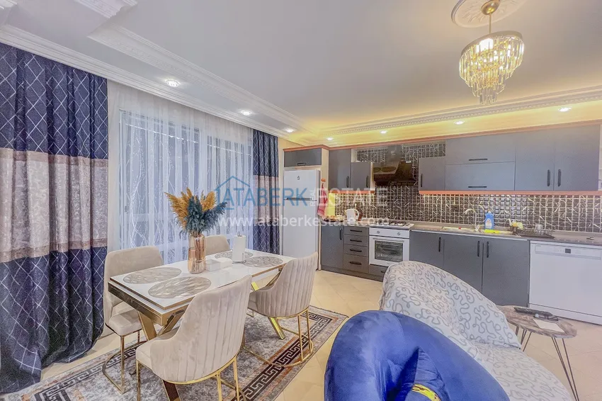 Purchase Two-bedroom apartment with new furniture and a glazed balcony in Mahmutlar 9 