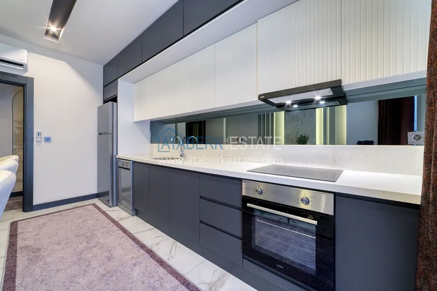 Purchase  An apartment with a designer interior and a separate kitchen in the center of Mahmutlar - Saturday Market District 11 