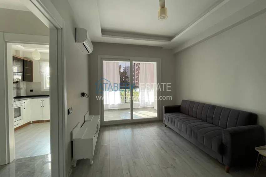 Purchase One bedroom apartment with new furniture, separate kitchen and 2 balconies in Mersin, Tomyuk 4