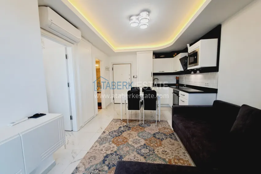 Purchase One bedroom apartment in the center of Alanya with furniture and access to a private beach 3