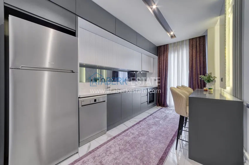 Purchase  An apartment with a designer interior and a separate kitchen in the center of Mahmutlar - Saturday Market District 10 