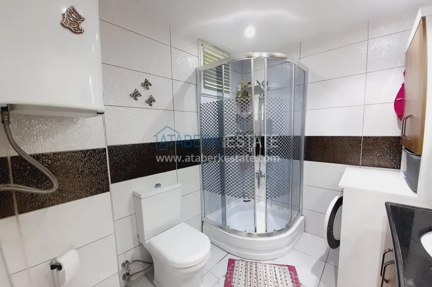 Purchase  Three-room apartment with separate kitchen and furniture in the center of Alanya	 11 