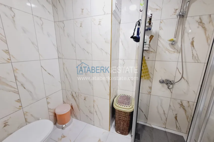 Purchase  Fully furnished apartment with a glazed balcony in the center of Mahmutlar at a bargain price 10 