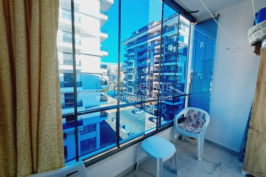Purchase  Fully furnished apartment with a glazed balcony in the center of Mahmutlar at a bargain price 11 