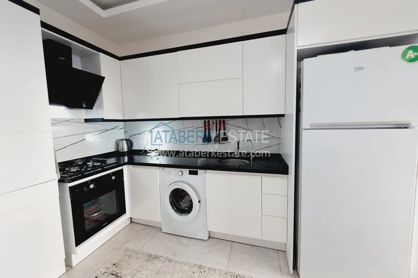 Purchase  Fully furnished apartment with a glazed balcony in the center of Mahmutlar at a bargain price 3 