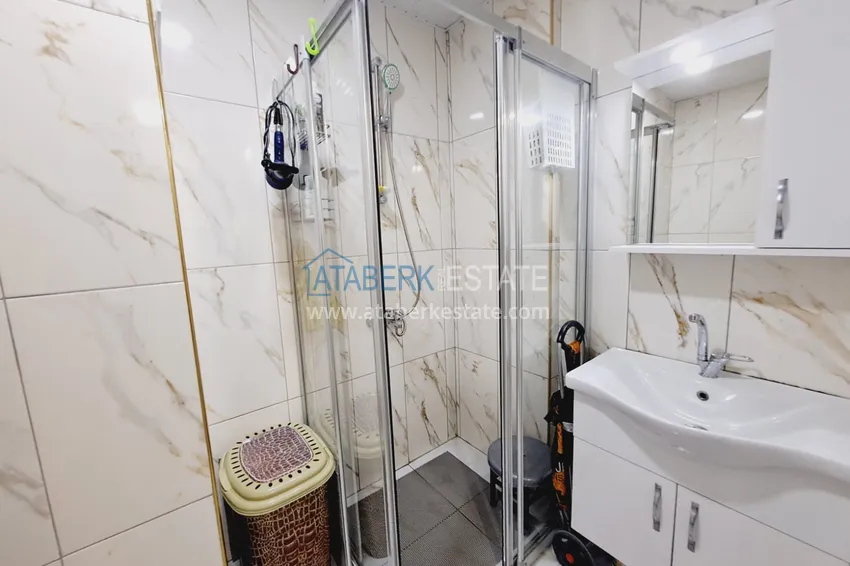 Purchase  Fully furnished apartment with a glazed balcony in the center of Mahmutlar at a bargain price 9 