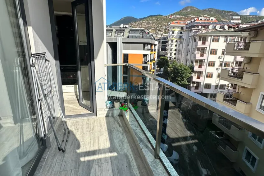 Purchase 2+1 apartment with furniture, separate kitchen and mountain views - Alanya Center 13