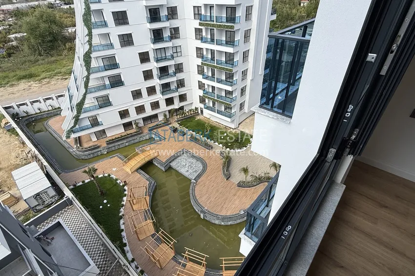 Purchase  Modern two-bedroom apartment with mountain views in a hotel-level residential complex, Mahmutlar - Alanya 24 