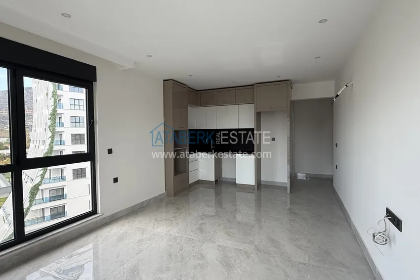 Purchase  Modern two-bedroom apartment with mountain views in a hotel-level residential complex, Mahmutlar - Alanya 2 