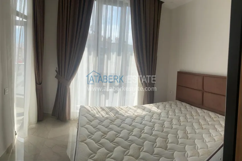 Purchase 1+1 apartment for rent in Alanya, Oba district center No. 31 11 