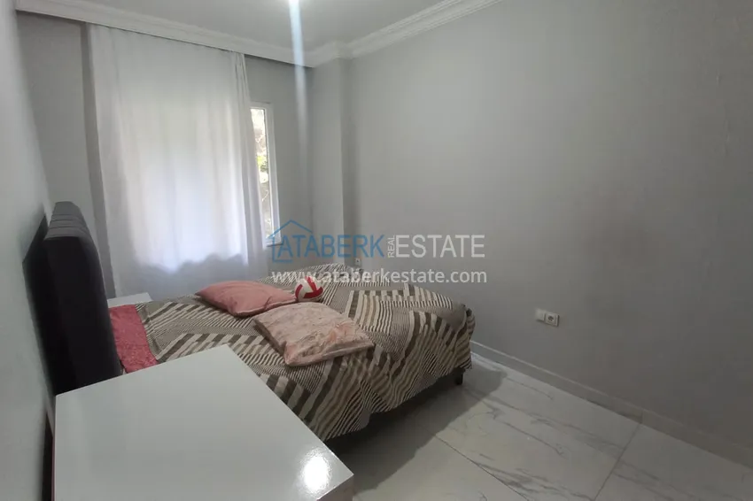 Purchase  Three-room city apartment with furniture and a separate kitchen in the center of Alanya  12 
