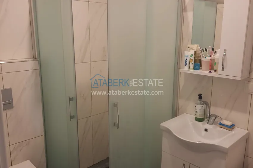 Purchase  Three-room city apartment with furniture and a separate kitchen in the center of Alanya  15 