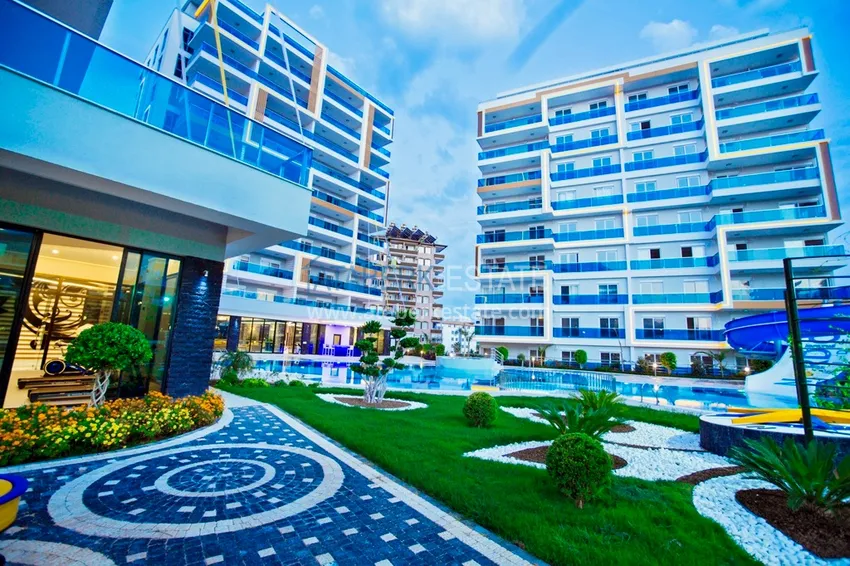 Apartment for rent in Alanya, Tosmur area - furnished, spacious terrace, luxury complex, 250 m beach 1