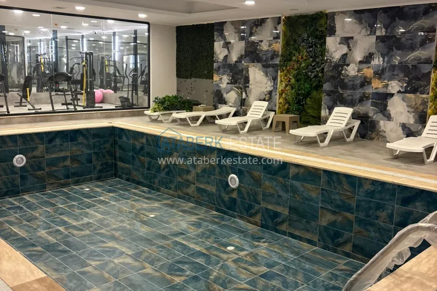 Modern 1+1 apartment with panoramic views in the heart of Mahmutlar - just 120 meters from the beach. 14 