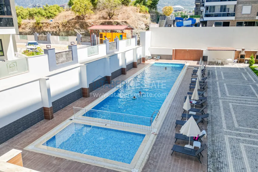 Cozy apartment 1+1 with furniture, glazed balcony and mountain view - Mahmutlar, Alanya 6 