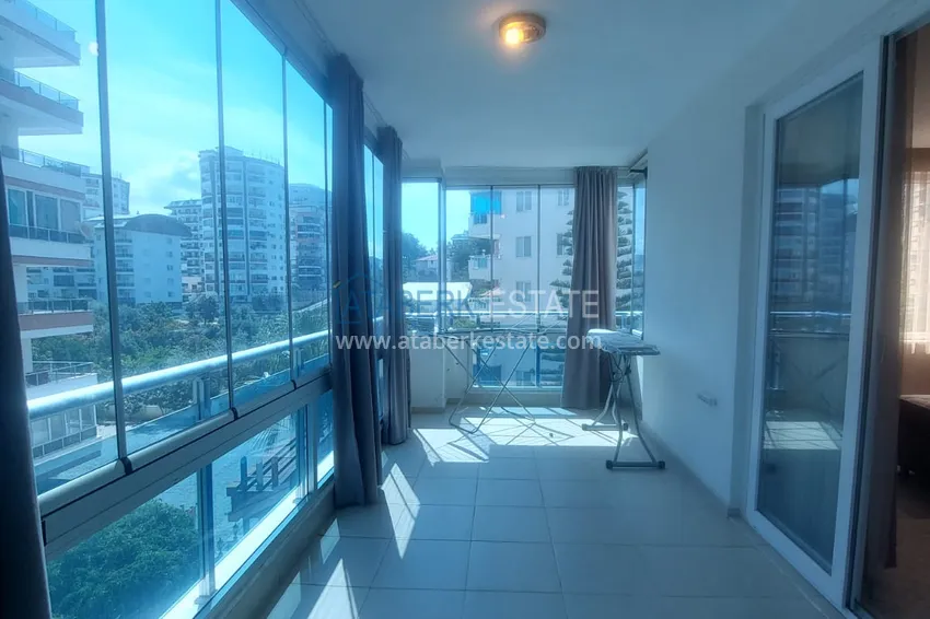 Purchase  Apartment 2+1 with furniture and two glazed balconies 450 meters from the sea - Mahmutlar 14 
