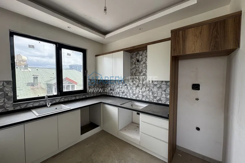 Purchase 2+1 penthouse with sea and mountain views in Demirtas — primary property in a small apartment complex 4 