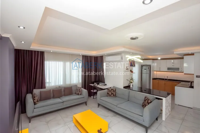 Purchase Two-level penthouse 2+1 with furniture and sea views in the center of Mahmutlar 3 