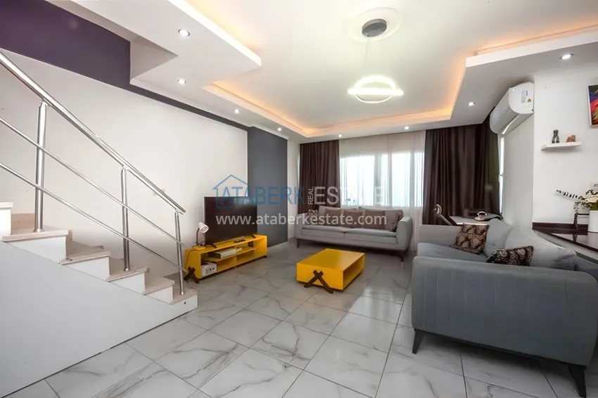 Purchase Two-level penthouse 2+1 with furniture and sea views in the center of Mahmutlar 4 
