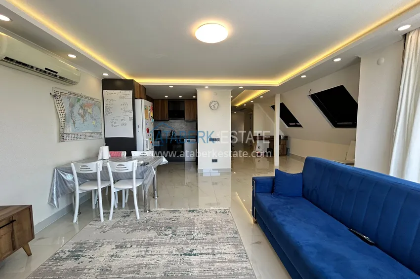 Purchase  2+1 penthouse duplex with sea and mountain views in the center of Alanya 8 