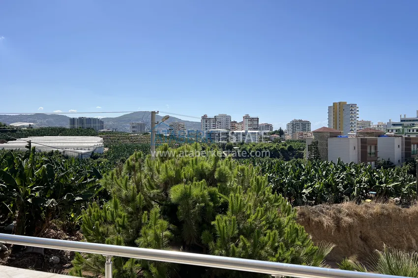 Purchase  2+1 apartment with furniture and mountain views in Mahmutlar at an attractive price 13 