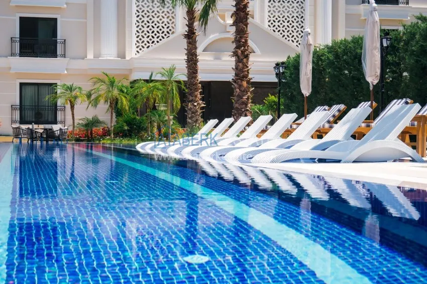 Luxury real estate on the first line in Alanya: stylish apartment, VIP-level complex, Oba district 9 