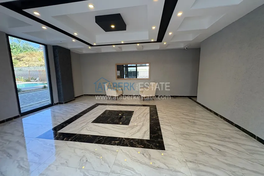 New 1+1 apartment in Mahmutlar, Alanya — new building with mountain views 12 