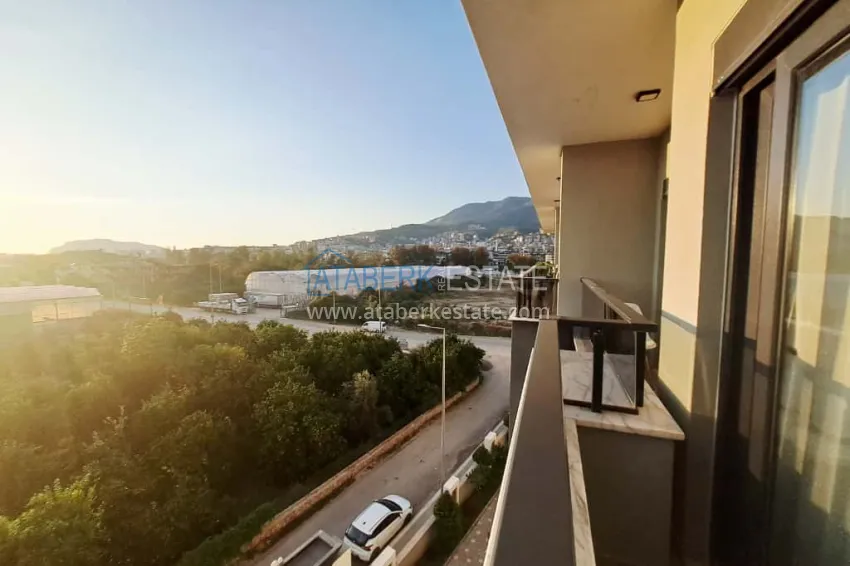 Purchase 1+1 apartment in Alanya, Oba district with furniture and mountain views — installments up to 6 months 12