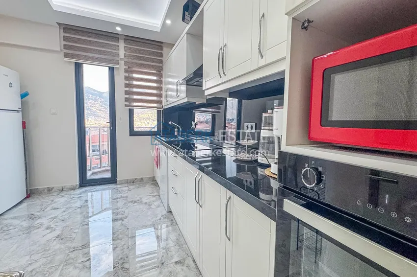 Purchase  3+1 apartment for a residence permit in Alanya, Kale district - furnished and with panoramic views of the sea and port  11 