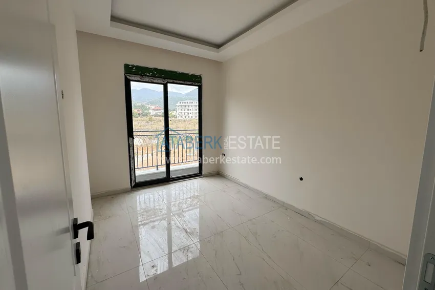 Purchase 1+1 apartment with mountain views in Alanya, Oba district 7 