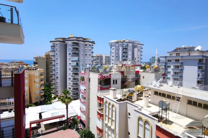 Purchase 2+1 apartment with sea view in the center of Mahmutlar — furniture, separate kitchen and glazed balcony 24 