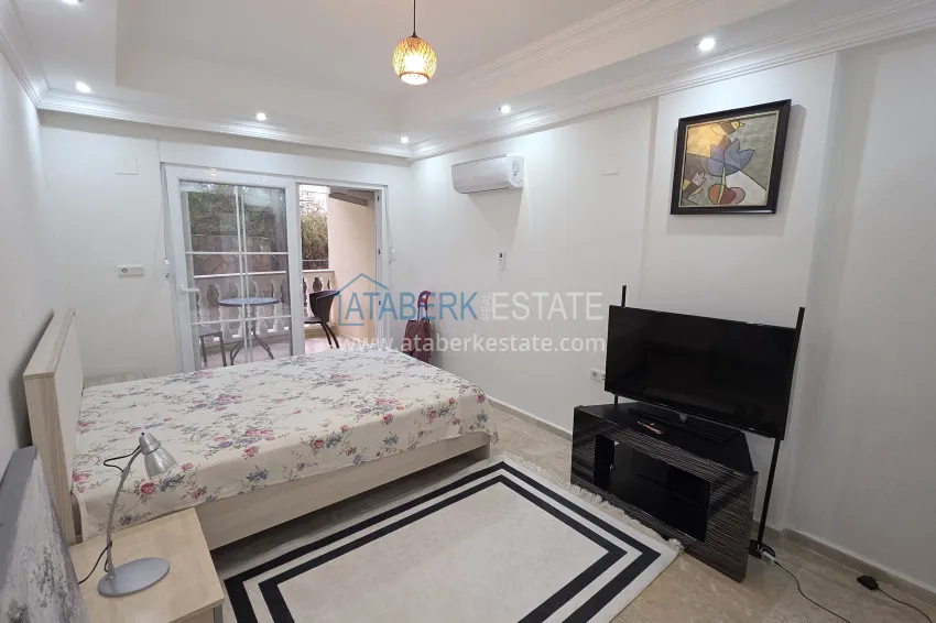 Purchase 2+1 apartment with furniture and access to the garden in the Avsallar area 17