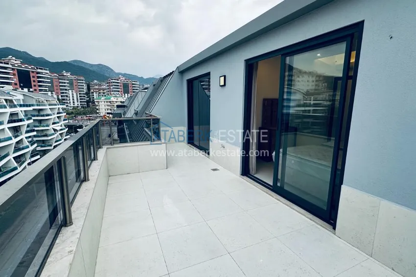 Purchase  Дуплекс-пентхаус 2+1 с дизайнерским ремонтом в премиальном комплексе в Алании, район Оба 12 