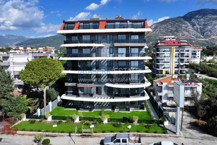 1+1 apartment overlooking the sea and the fortress on the beachfront in Kestel 12 