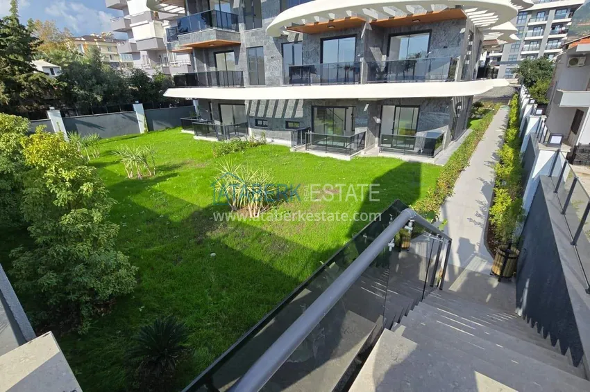 1+1 apartment overlooking the sea and the fortress on the beachfront in Kestel 15 