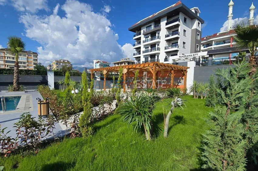 1+1 apartment overlooking the sea and the fortress on the beachfront in Kestel 21 